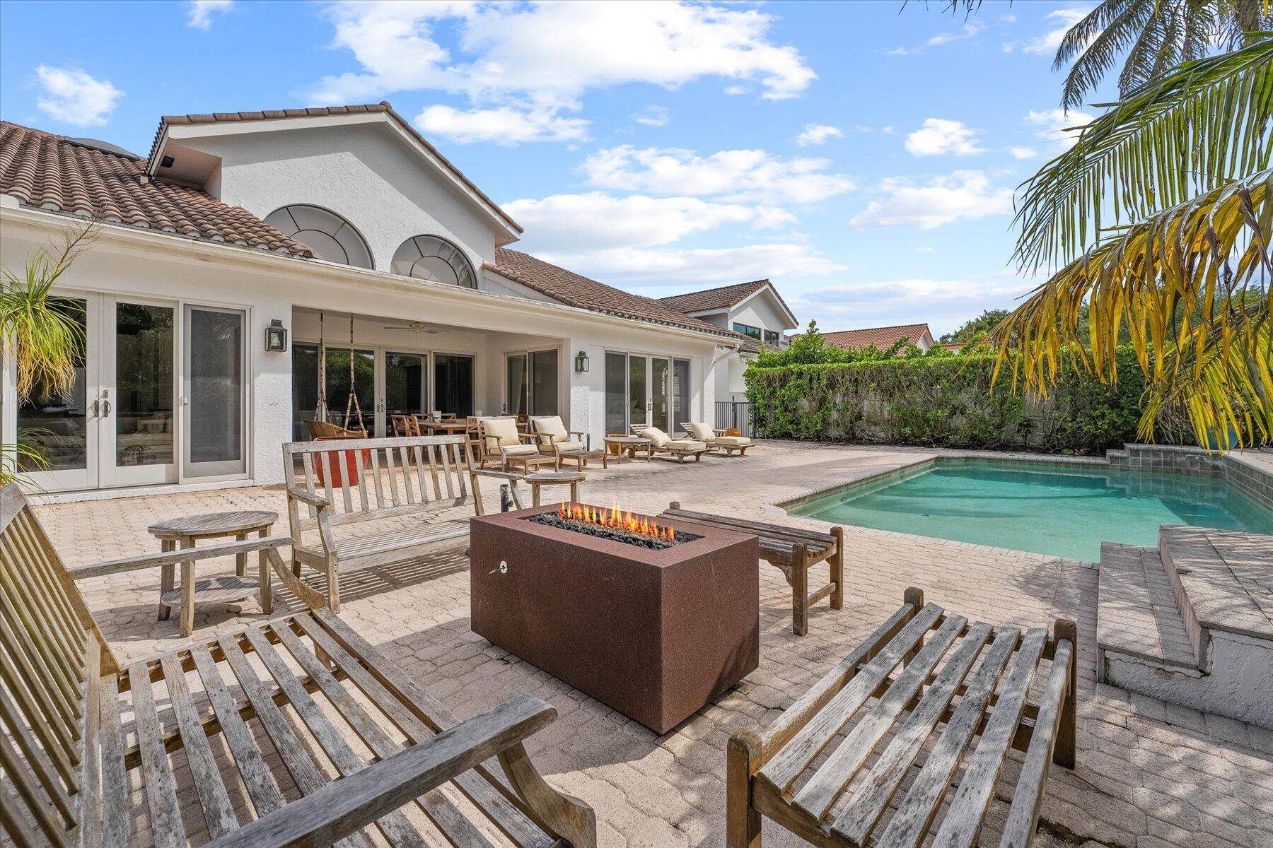 2821 Bent Cypress Road Wellington, FL 33414 - Photo 57 of 64 a front view of a house with a yard