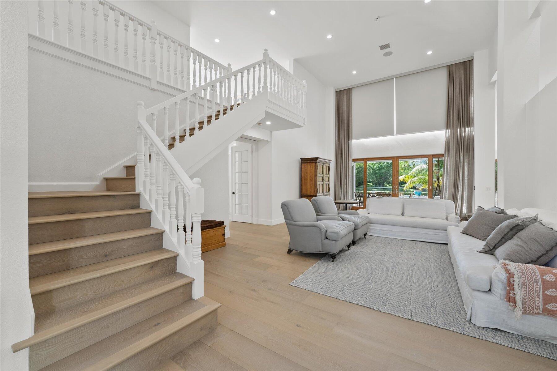 2821 Bent Cypress Road Wellington, FL 33414 - Photo 6 of 64 a living room with furniture and a large window