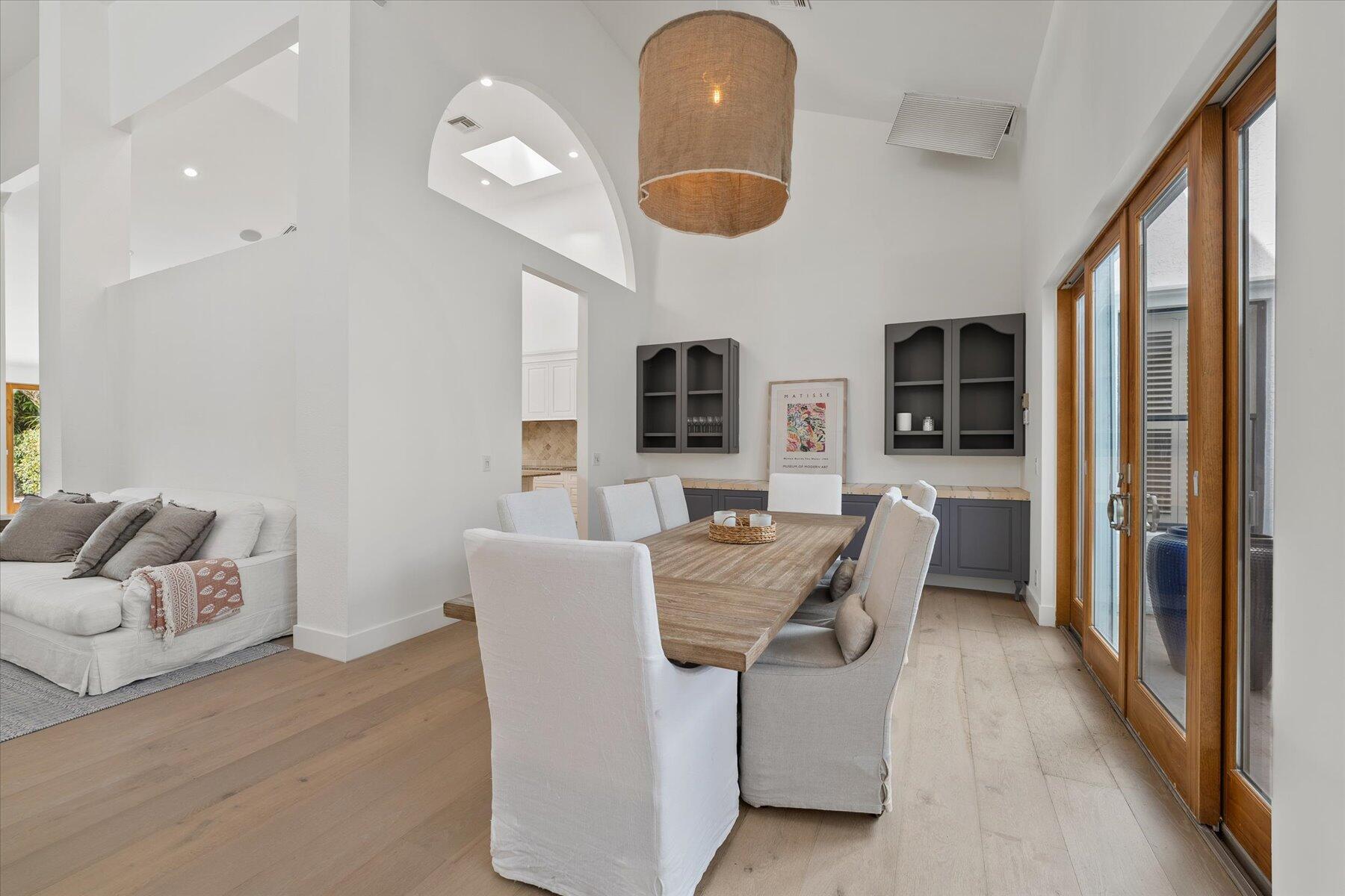 2821 Bent Cypress Road Wellington, FL 33414 - Photo 7 of 64 a dining room with furniture and a large mirror
