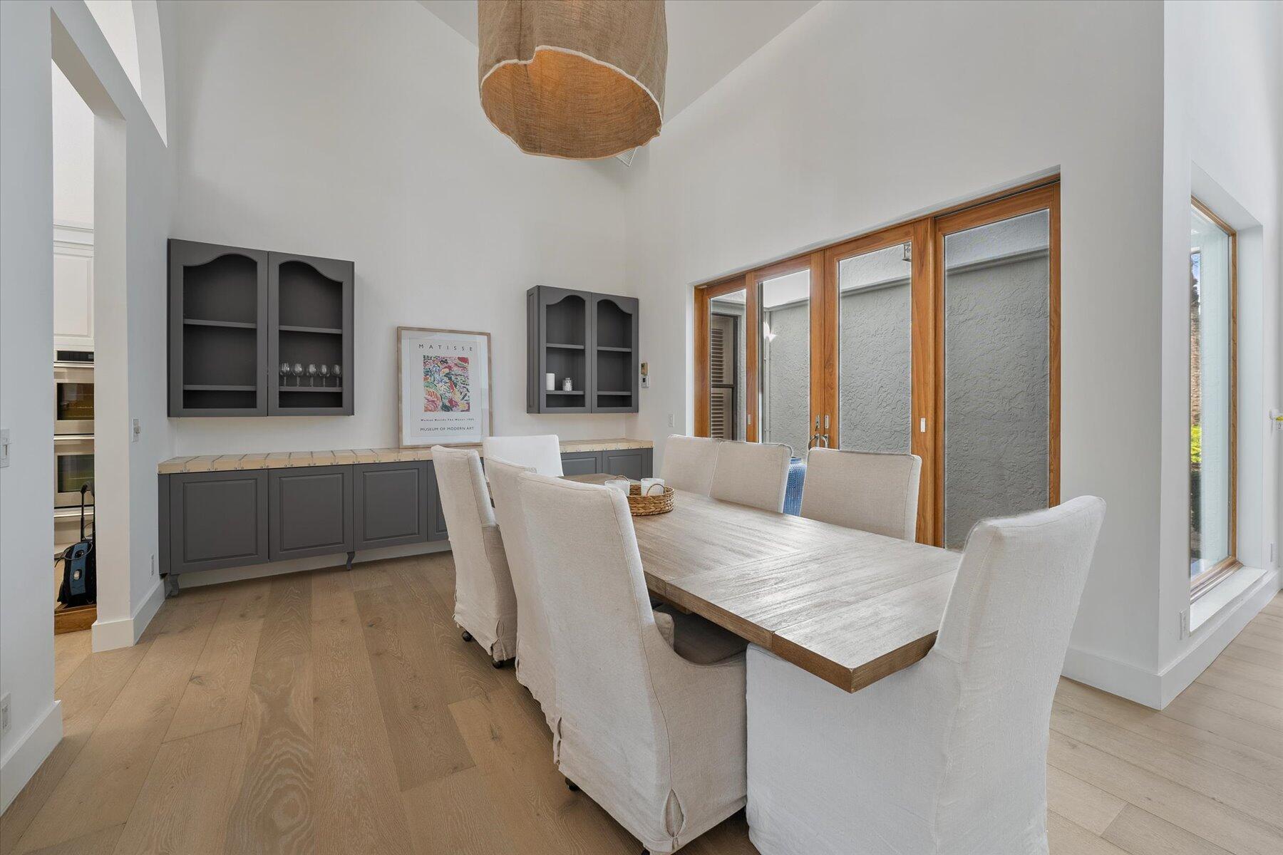 2821 Bent Cypress Road Wellington, FL 33414 - Photo 8 of 64 a living room with furniture a flat screen tv and a table