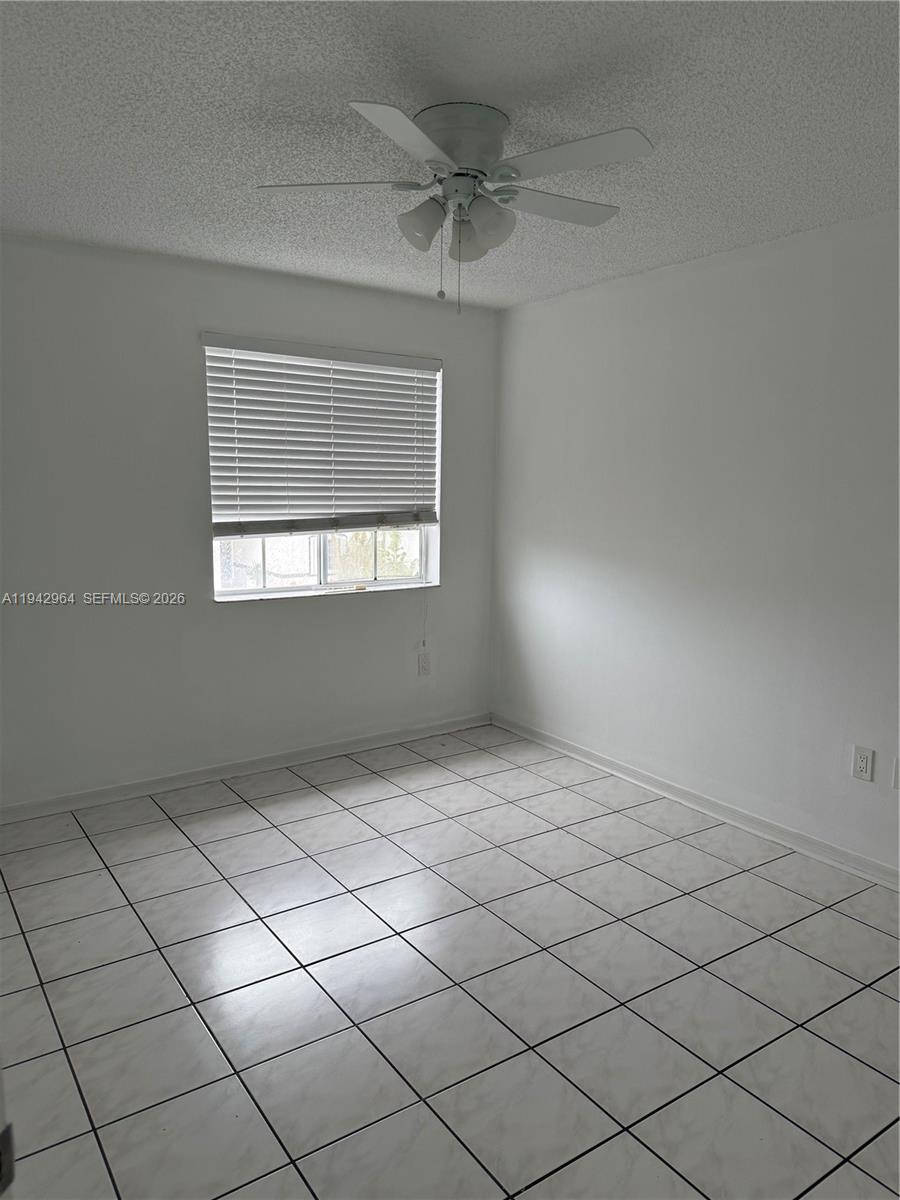 15870 Southwest 85th Lane Miami, FL 33193 - Photo 15 of 18 a view of an empty room and window
