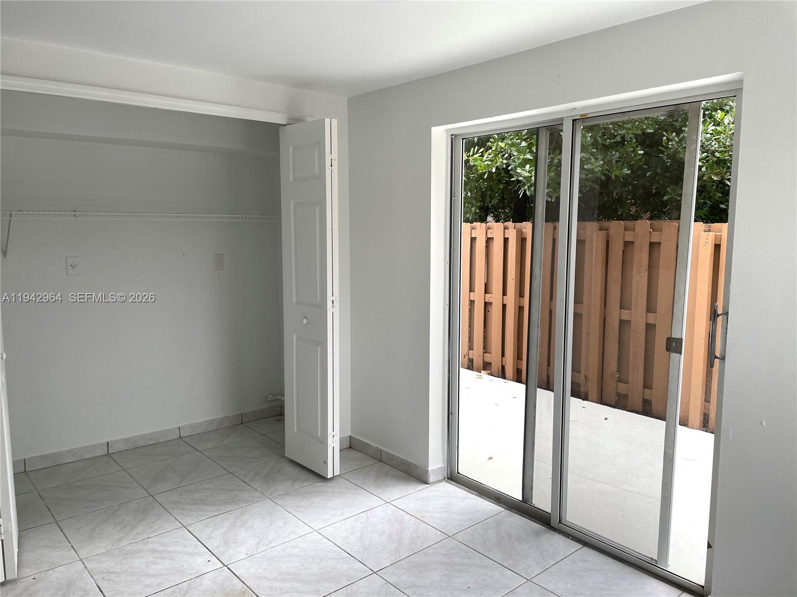 15870 Southwest 85th Lane Miami, FL 33193 - Photo 5 of 18 a view of a small space with sliding door and mountain view