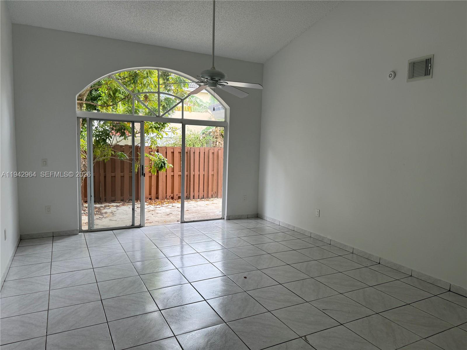 15870 Southwest 85th Lane Miami, FL 33193 - Photo 6 of 18 an empty room with windows