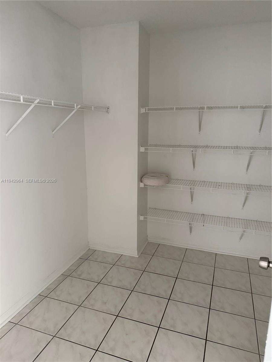 15870 Southwest 85th Lane Miami, FL 33193 - Photo 8 of 18 a view of a rack and shelf