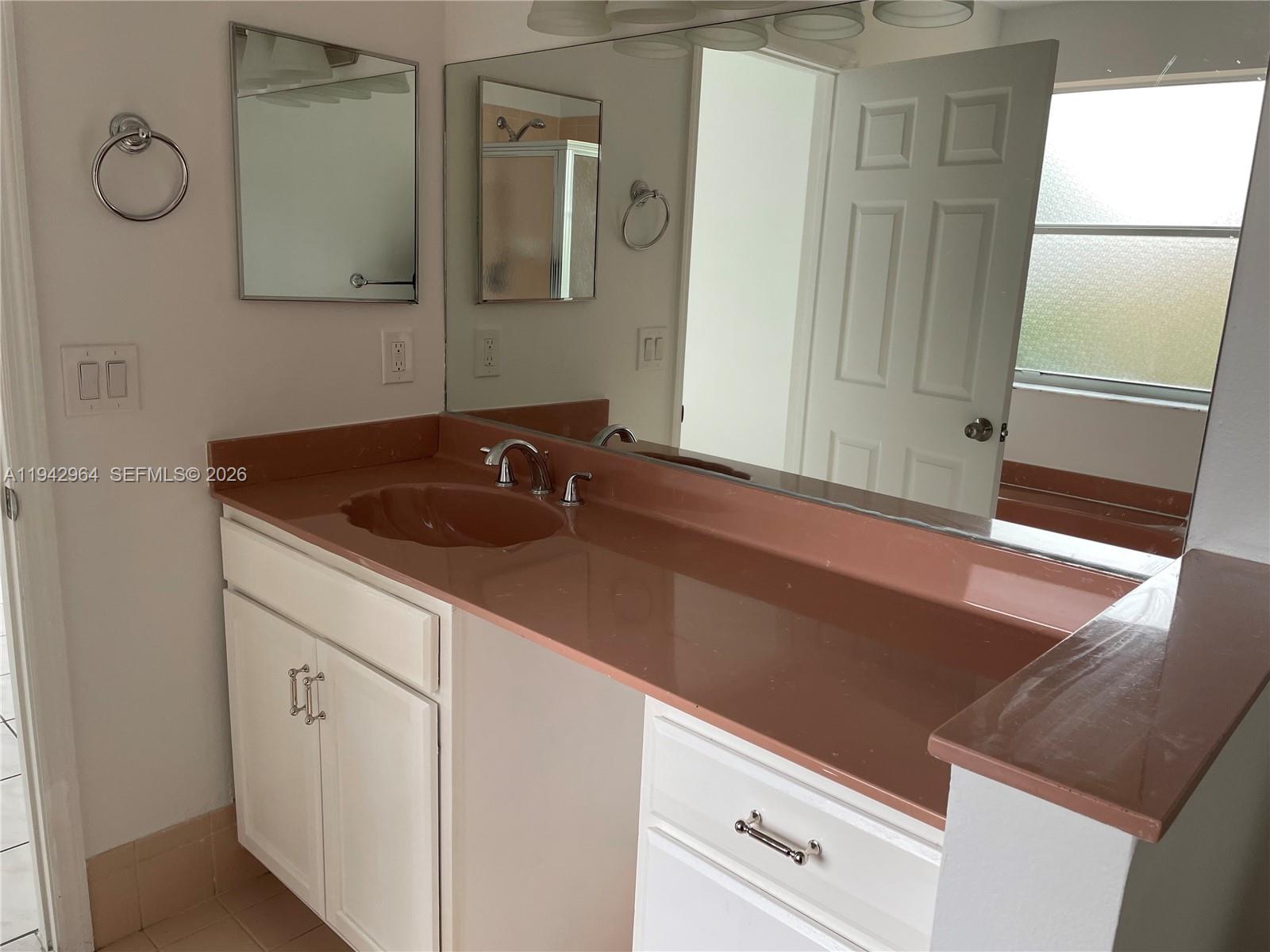 15870 Southwest 85th Lane Miami, FL 33193 - Photo 10 of 18 a close view of a sink a counter and utility room