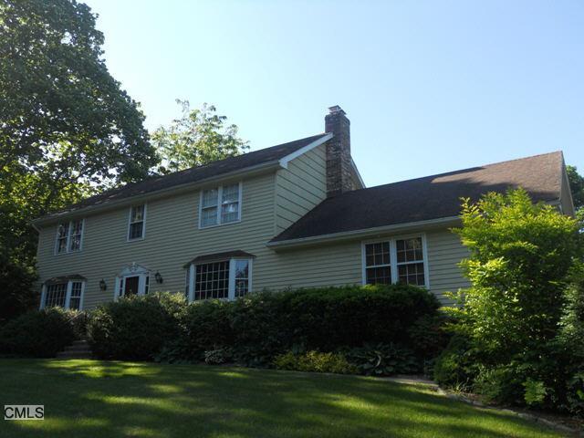 51 Spinning Wheel Road Monroe, CT 06468 - Photo 1 of 1 a front view of a house with a garden