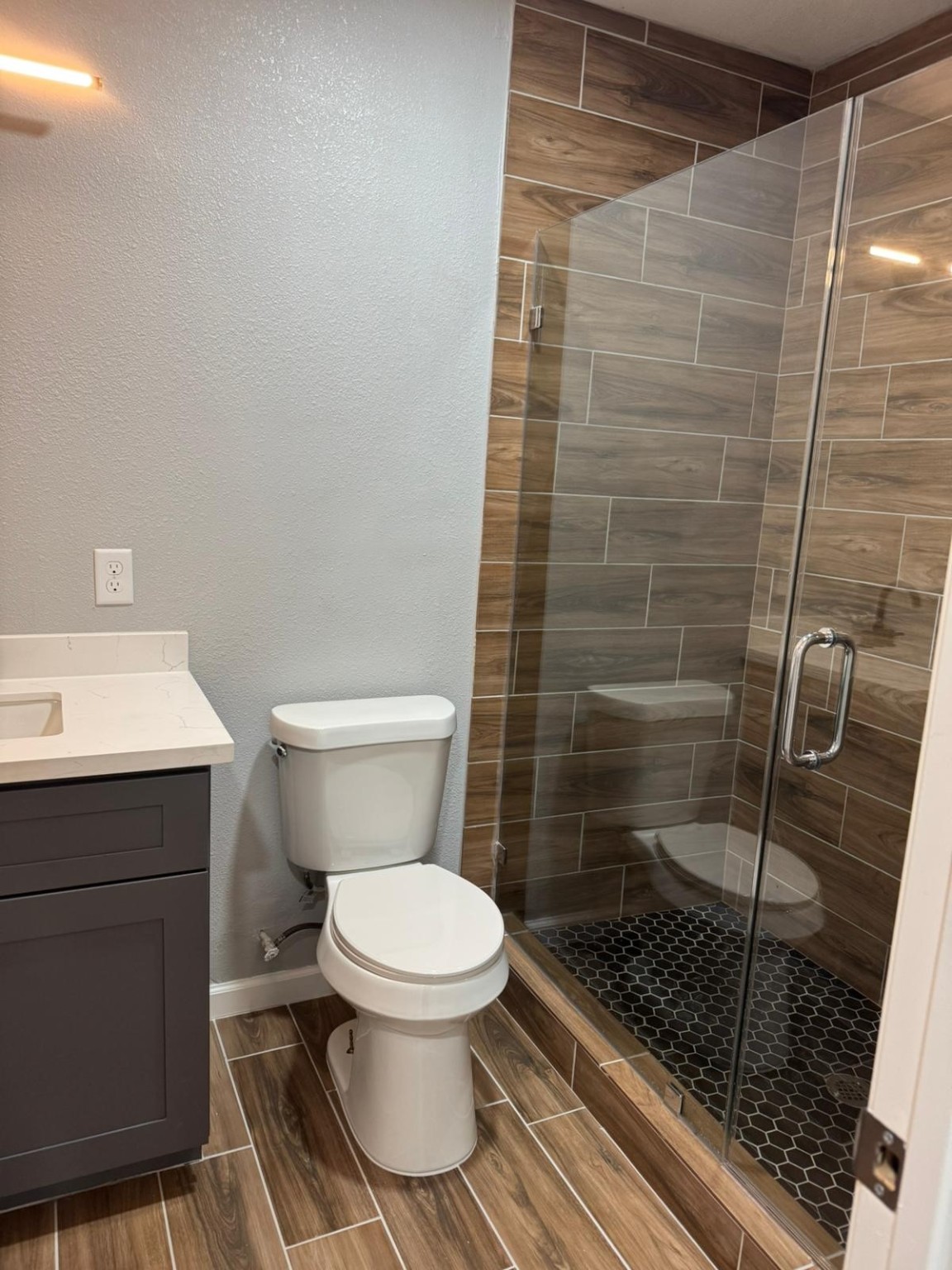 3934 Alice Street Houston, TX 77021 - Photo 8 of 9 a bathroom with a toilet and a shower