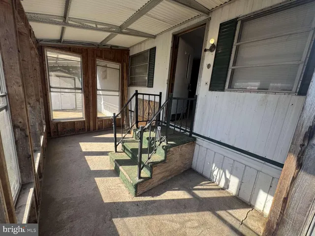 a view of staircase with a rug