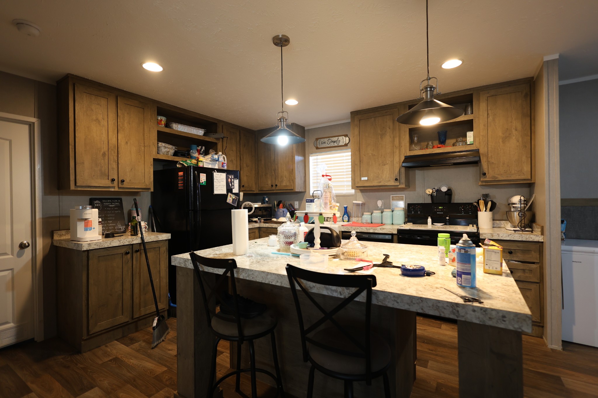 298 Fly Road Shelbyville, TN 37160 - Photo 5 of 21 a kitchen with stainless steel appliances kitchen island granite countertop a sink a stove a refrigerator cabinets and chairs