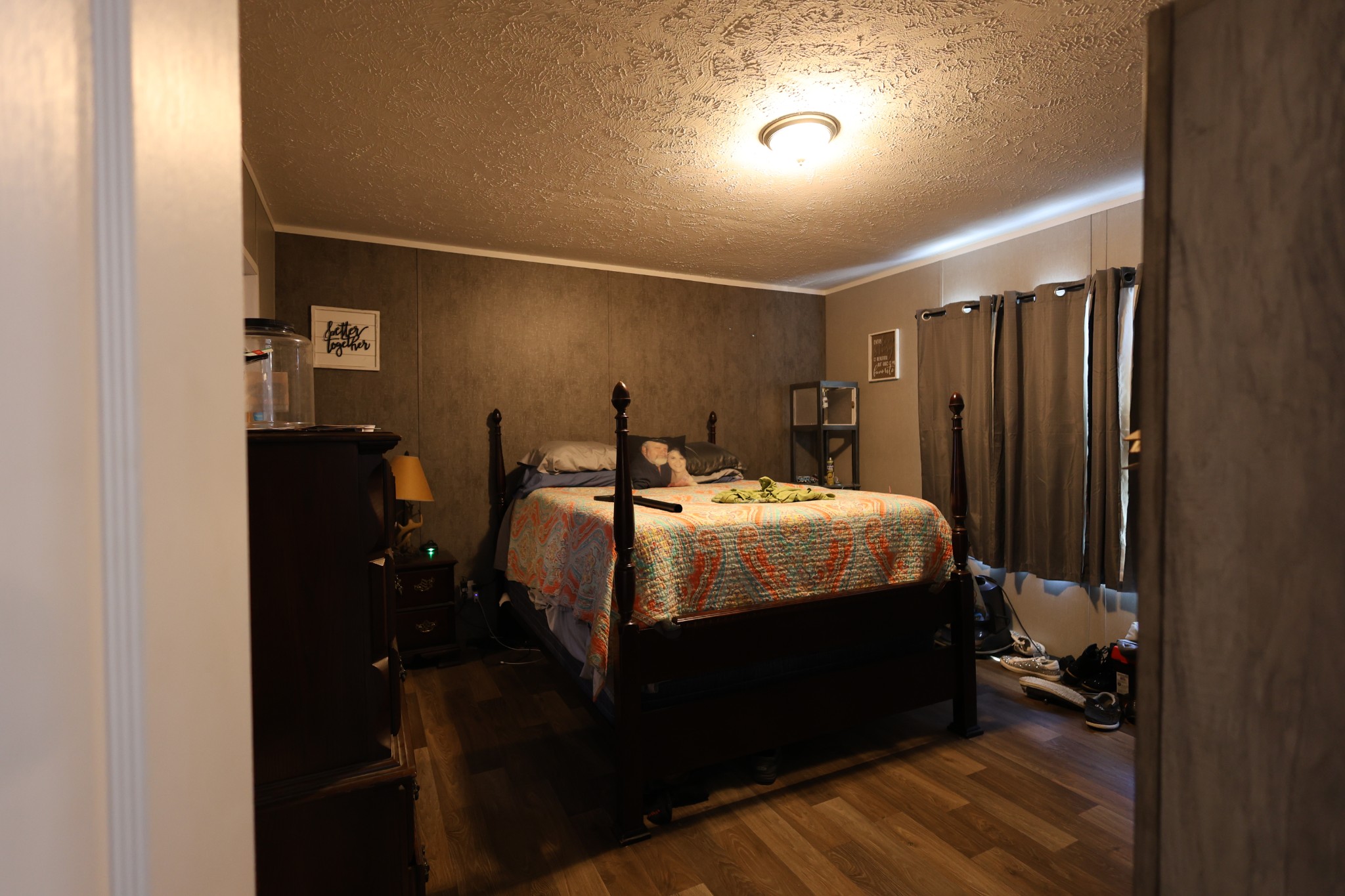 298 Fly Road Shelbyville, TN 37160 - Photo 9 of 21 a bed sitting in a bedroom next to a bathroom