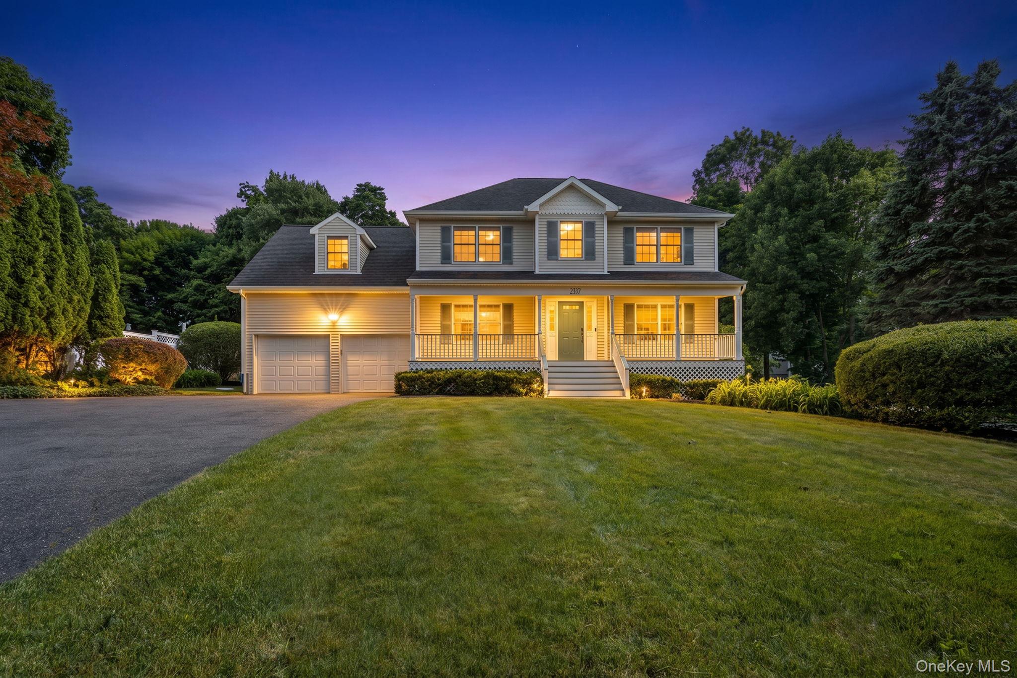 2211 Crompond Road Yorktown Heights, NY 10598 - Photo 1 of 38 a front view of a house with a yard and garage