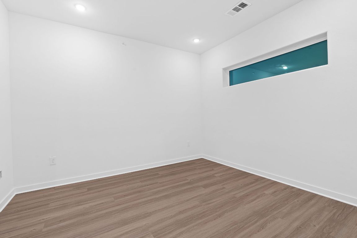 100 West Mockingbird Lane, Unit 308 Austin, TX 78745 - Photo 12 of 23 a view of a room with wooden floor