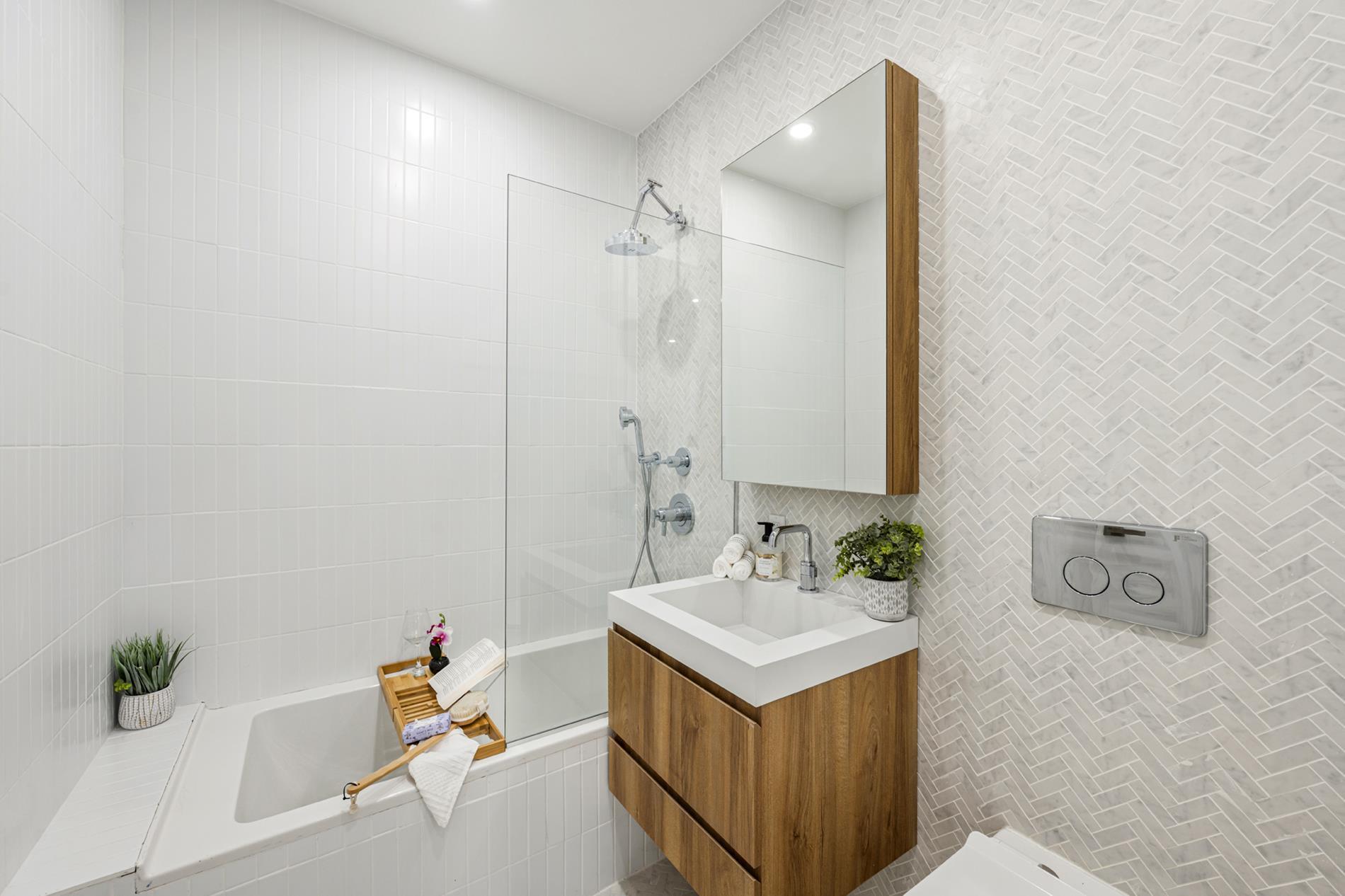 54 Dupont Street, Unit 2F Brooklyn, NY 11222 - Photo 7 of 10 a bathroom with a sink vanity and a mirror