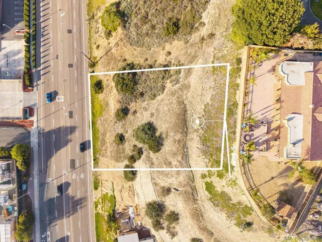 an aerial view of residential building with parking space