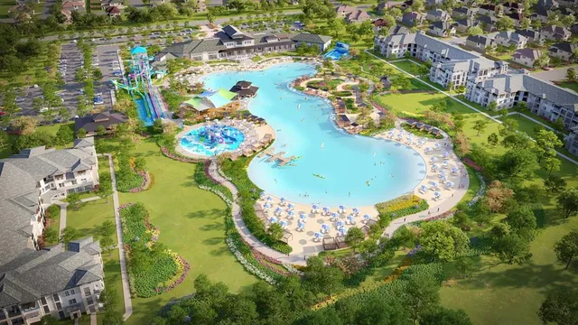 an aerial view of a swimming pool a yard and lake view