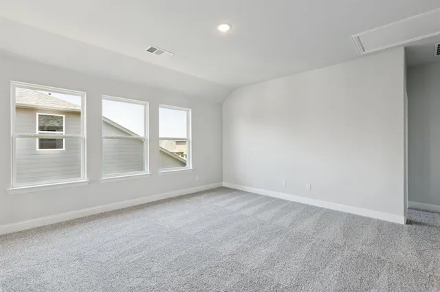 an outdoor space with lots of tables and chairs