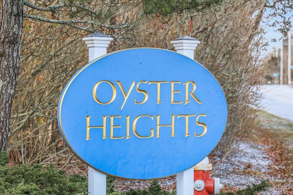 97 Depot Road, Unit 20 Chatham, MA 02633 - Photo 4 of 25 oyster heights sign