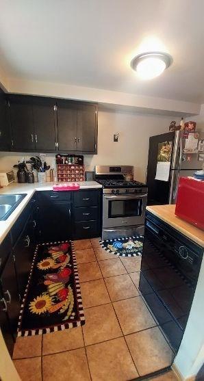 28 Aber Road Finleyville, PA 15332 - Photo 5 of 24 Stainless steel appliances and ceramic floor.