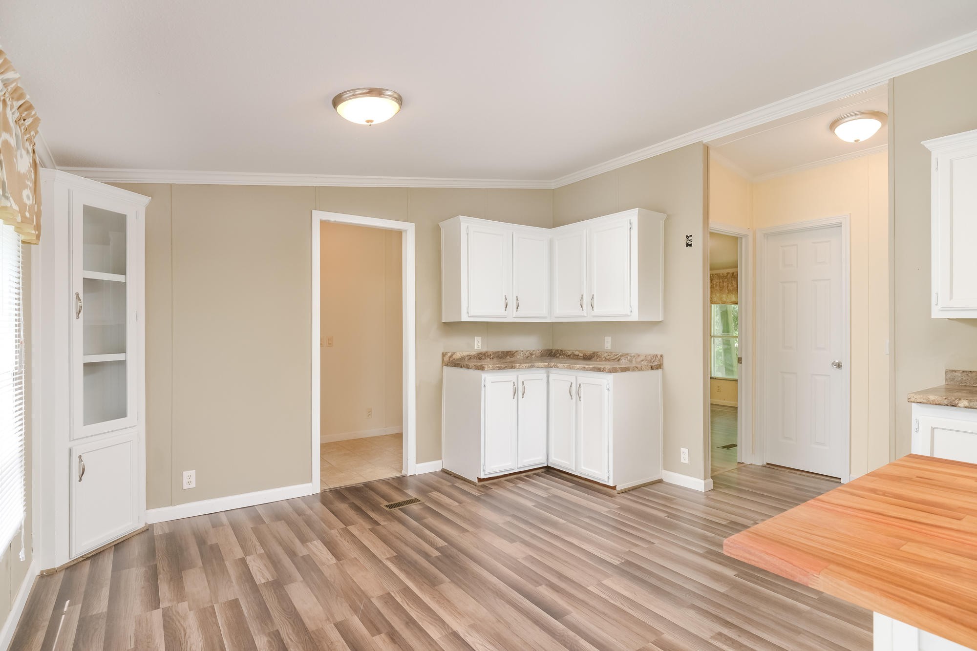 2666 Glass Mill Road Chickamauga, GA 30707 - Photo 13 of 28 a view of a kitchen with wooden floor and a sink