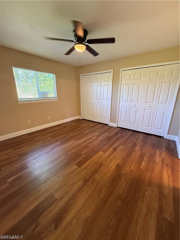 724 Hightower Avenue South Lehigh Acres, FL 33973 - Photo 3 of 7 a view of an empty room with wooden floor and a window