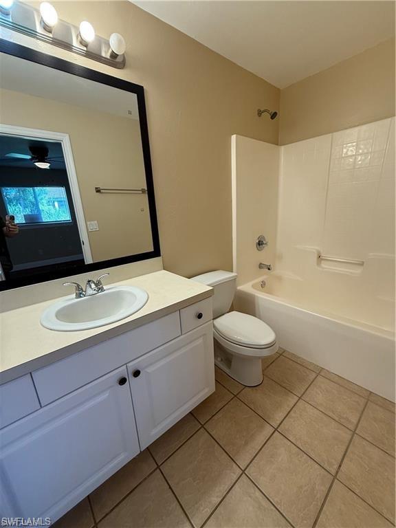 724 Hightower Avenue South Lehigh Acres, FL 33973 - Photo 7 of 7 a bathroom with a sink a toilet and a mirror