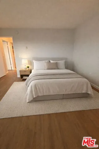 a view of an empty room and wooden floor