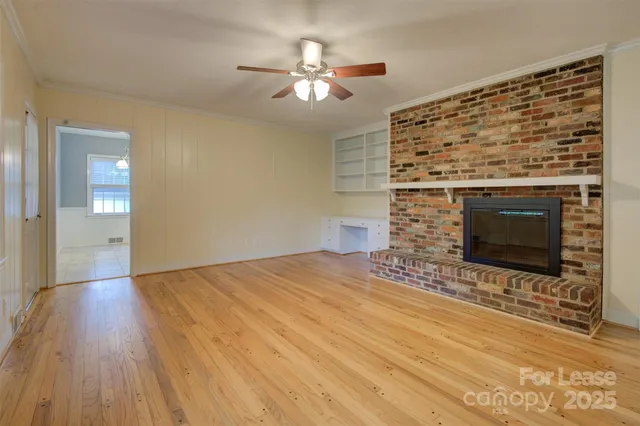 a view of an empty room and fire place