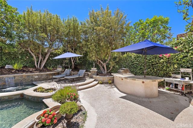 a view of a swimming pool with lounge chairs