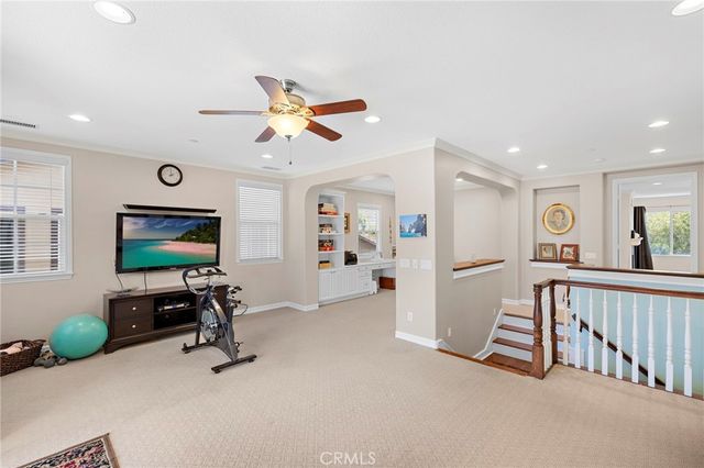 a view of a livingroom with furniture and a flat screen tv