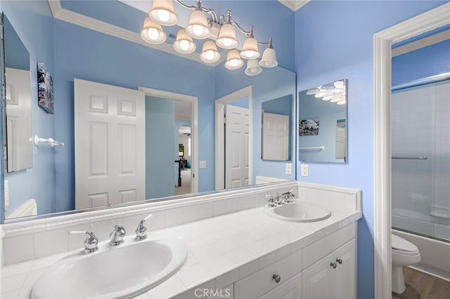 a bathroom with a sink double vanity and a mirror