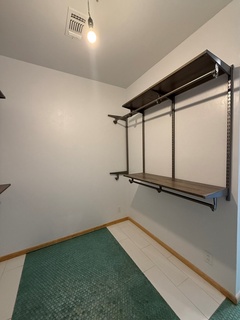 150 Dowling Road West Ingram, TX 78025 - Photo 14 of 33 a bathroom with a window a vanity and a shower