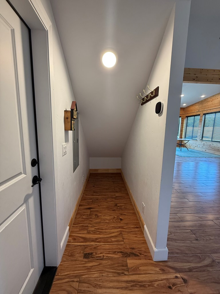 150 Dowling Road West Ingram, TX 78025 - Photo 19 of 33 a view of a hallway with wooden floor and staircase