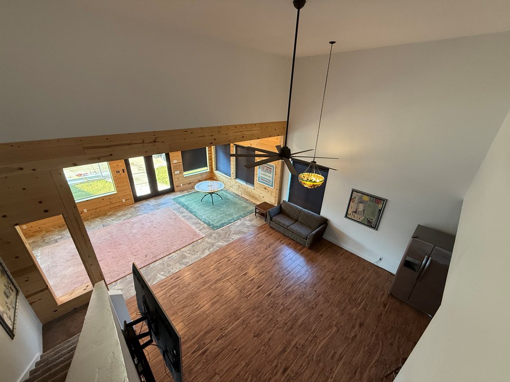 150 Dowling Road West Ingram, TX 78025 - Photo 27 of 33 a living room with a bed furniture and a wooden floor