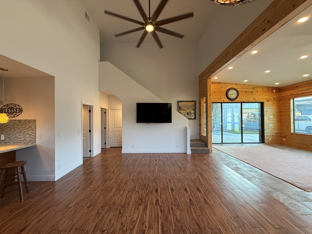 150 Dowling Road West Ingram, TX 78025 - Photo 7 of 33 a view of a livingroom with wooden floor and a ceiling fan