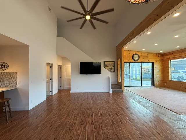 a view of kitchen and hall with wooden floor