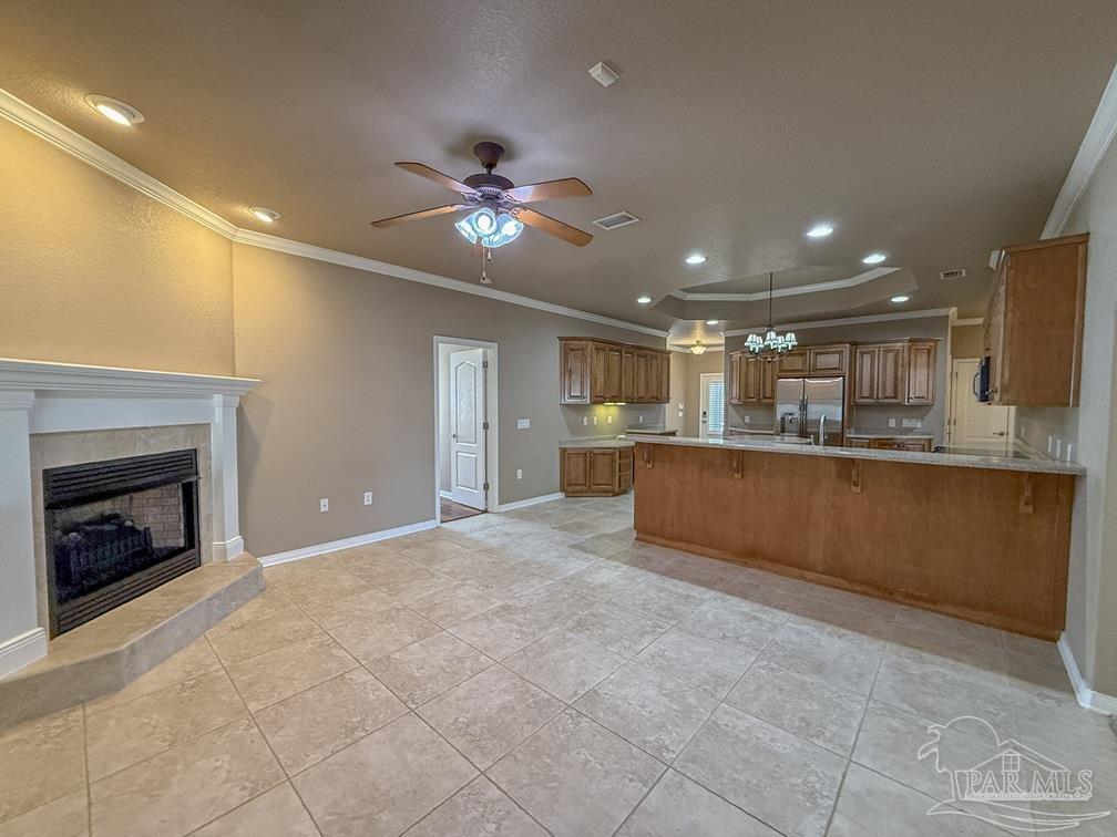 3554 Haley Way Pace, FL 32571 - Photo 11 of 40 a view of kitchen with kitchen island a sink and a fireplace