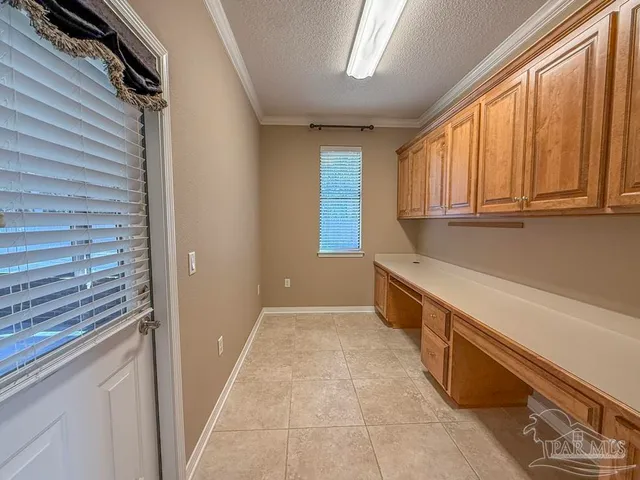 a kitchen with refrigerator a sink and a stove