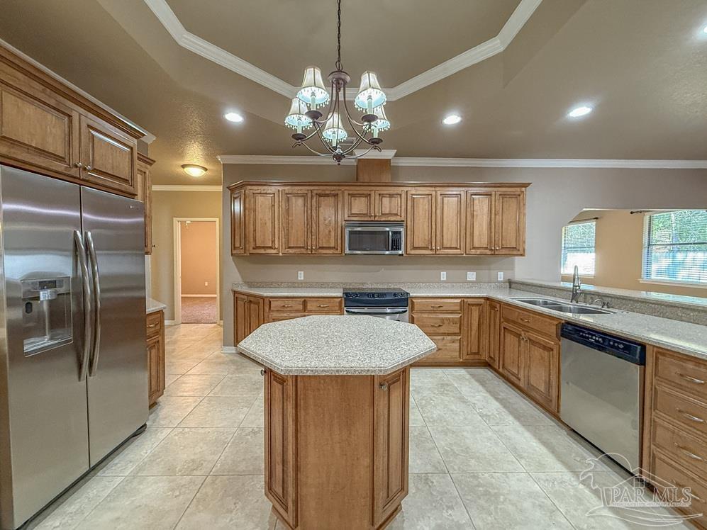 3554 Haley Way Pace, FL 32571 - Photo 26 of 40 a kitchen with stainless steel appliances granite countertop a sink a counter space cabinets and stainless steel appliances