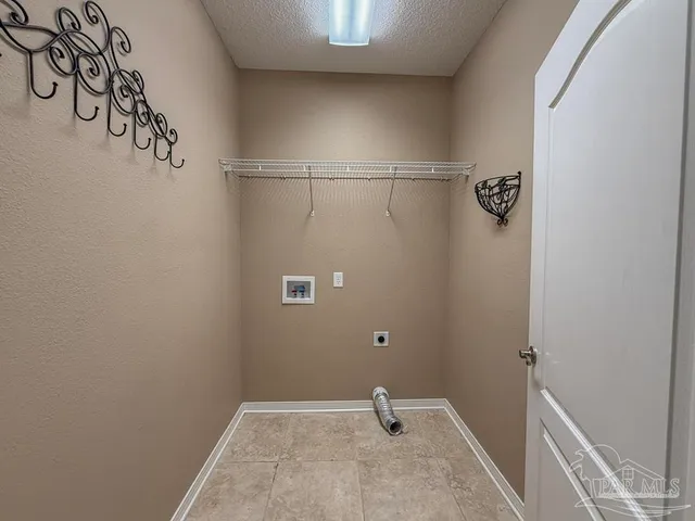 a view of an empty room with a bathroom