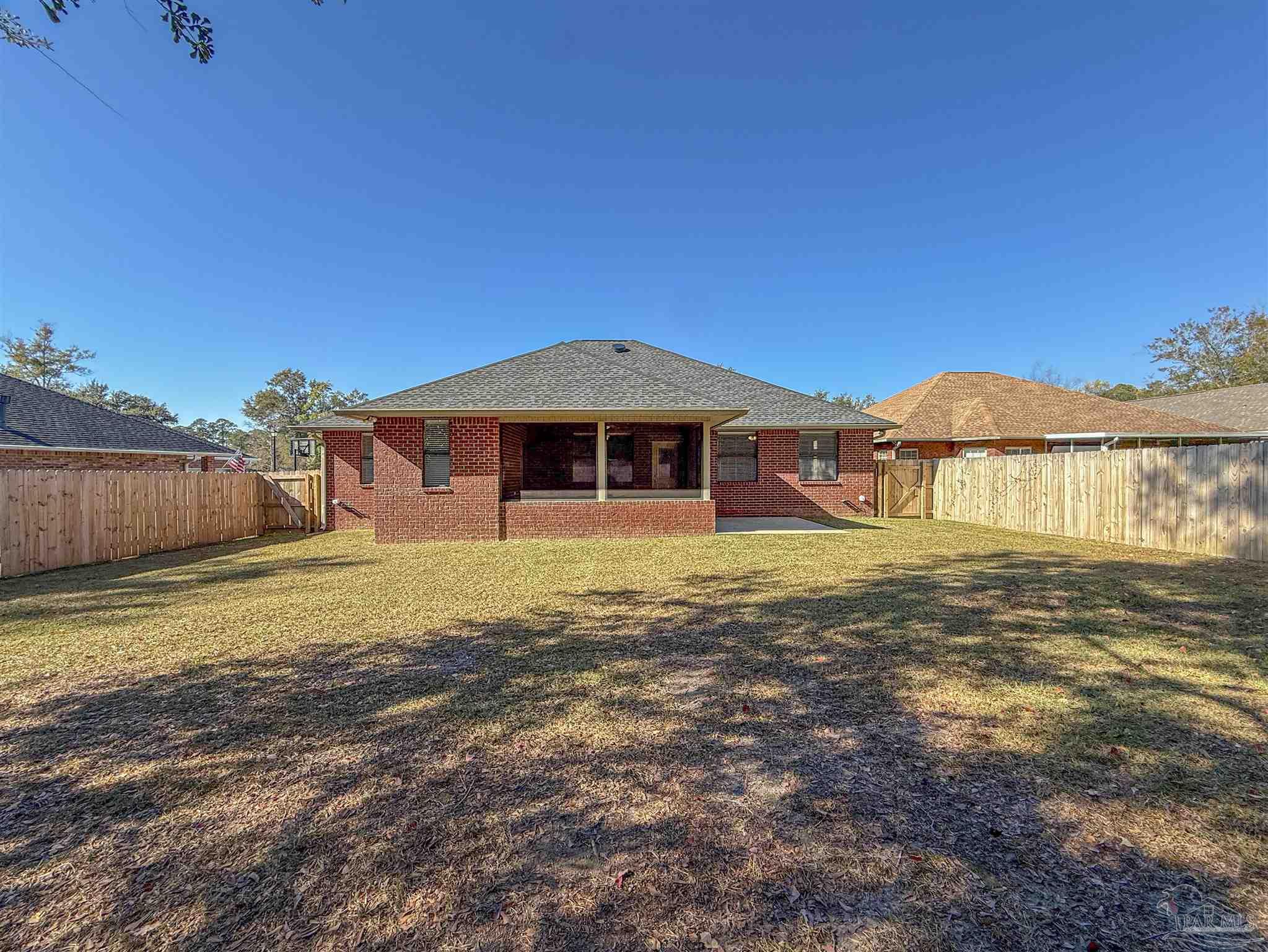 3554 Haley Way Pace, FL 32571 - Photo 39 of 40 a front view of a house with a yard