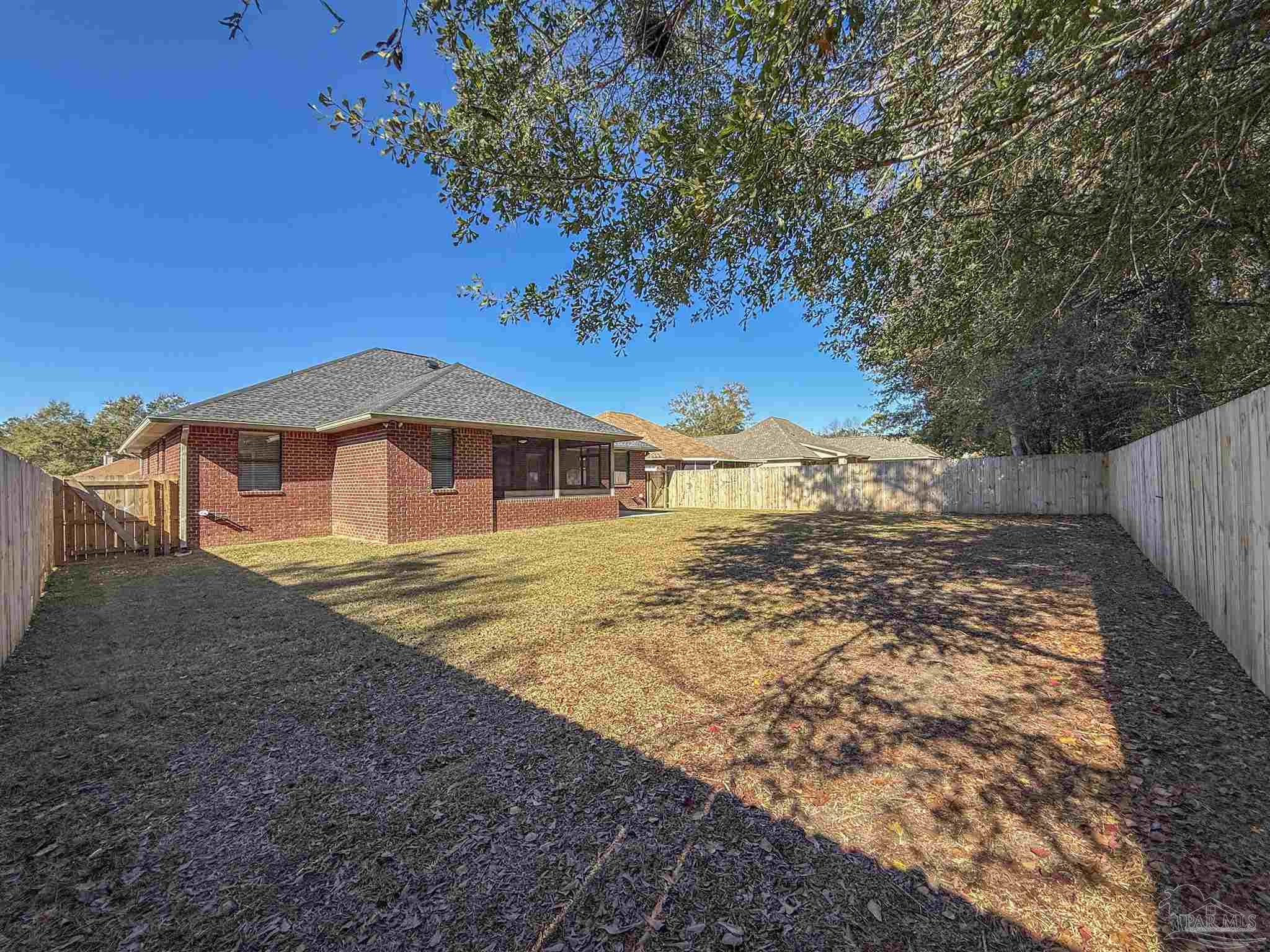 3554 Haley Way Pace, FL 32571 - Photo 40 of 40 a view of a house with a yard