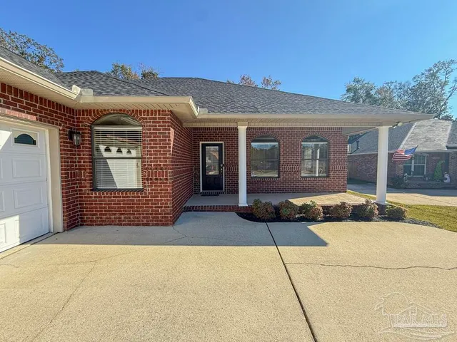 a front view of a house with a garage