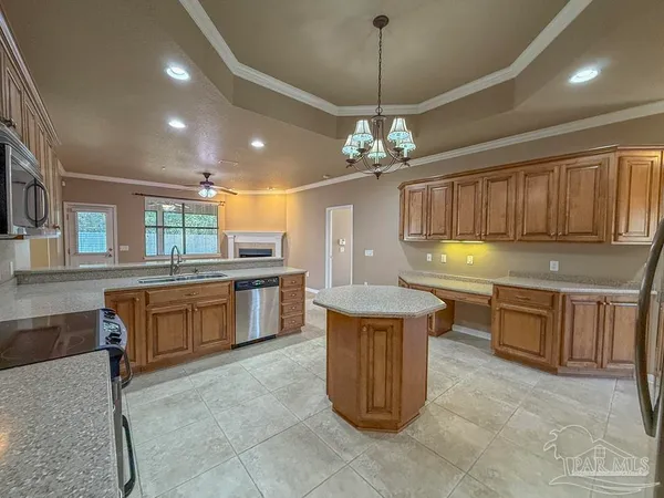 a kitchen with stainless steel appliances granite countertop a stove and a sink