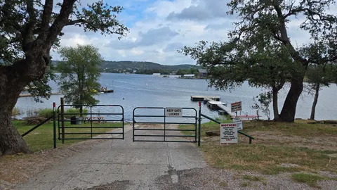 a view of a lake with houses in the back