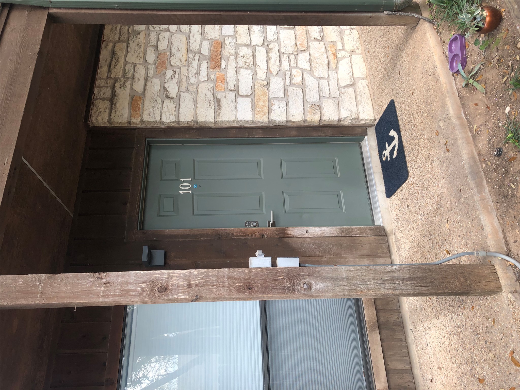 a bathroom with a granite countertop sink and a shower