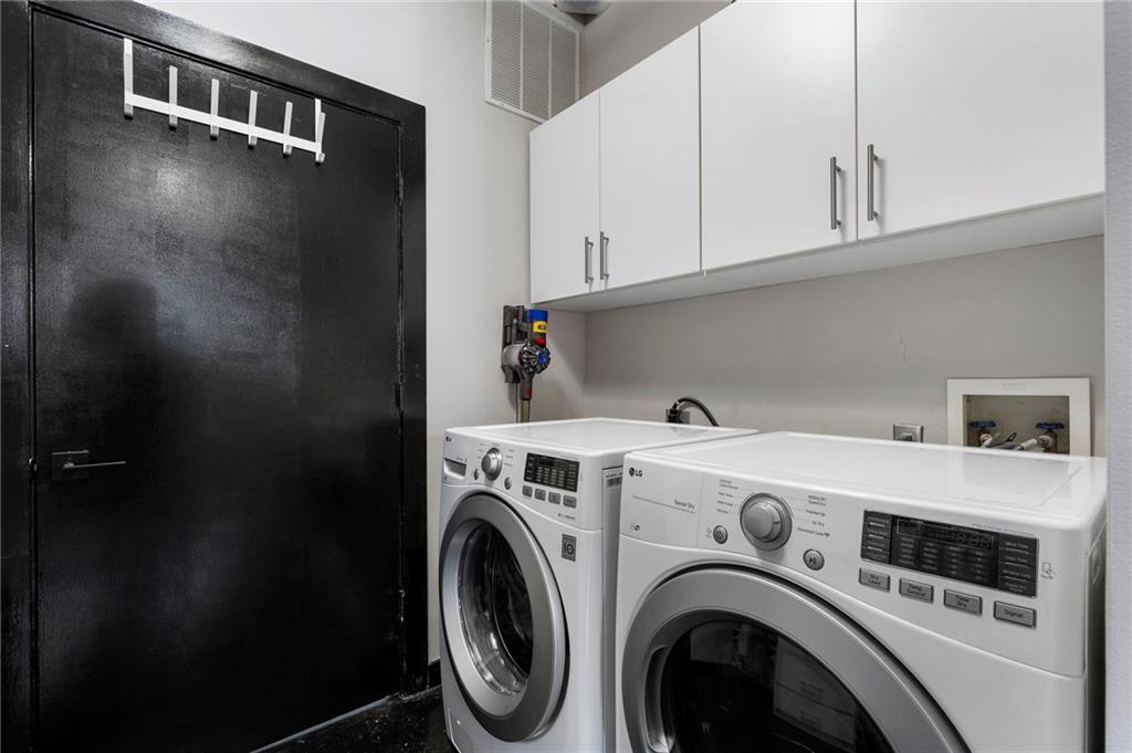 878 Peachtree Street Northeast, Unit 601 Atlanta, GA 30309 - Photo 24 of 43 a utility room with dryer and washer