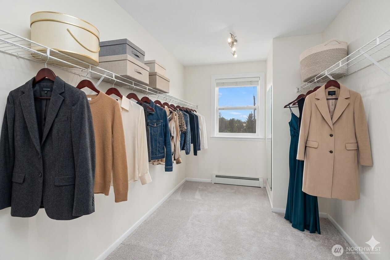 4014 Southwest 98th Street Seattle, WA 98136 - Photo 14 of 36 a view of walk in closet with clothes and shoes