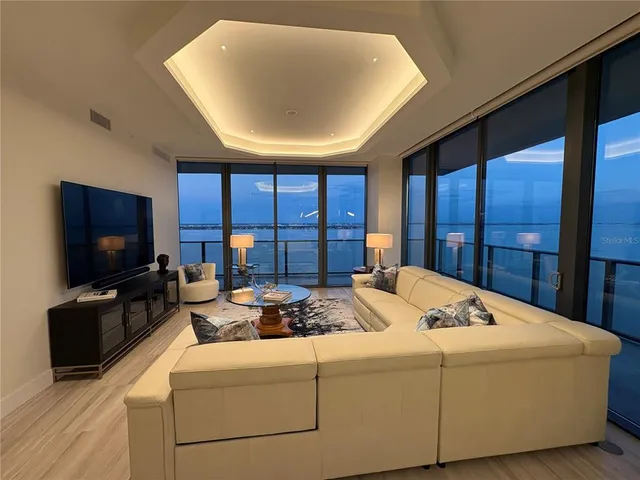 a bathroom with a granite countertop sink a toilet and a mirror