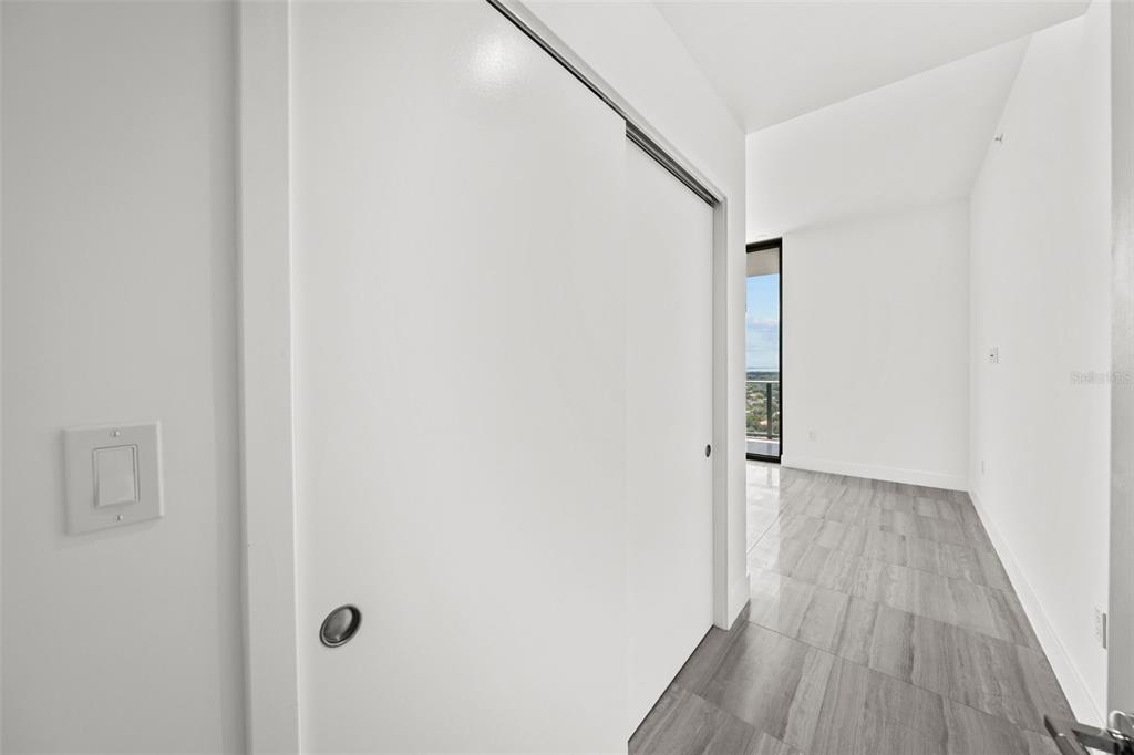 3101 Bayshore Boulevard, Unit 2004 Tampa, FL 33629 - Photo 36 of 64 a view of a hallway with wooden floor