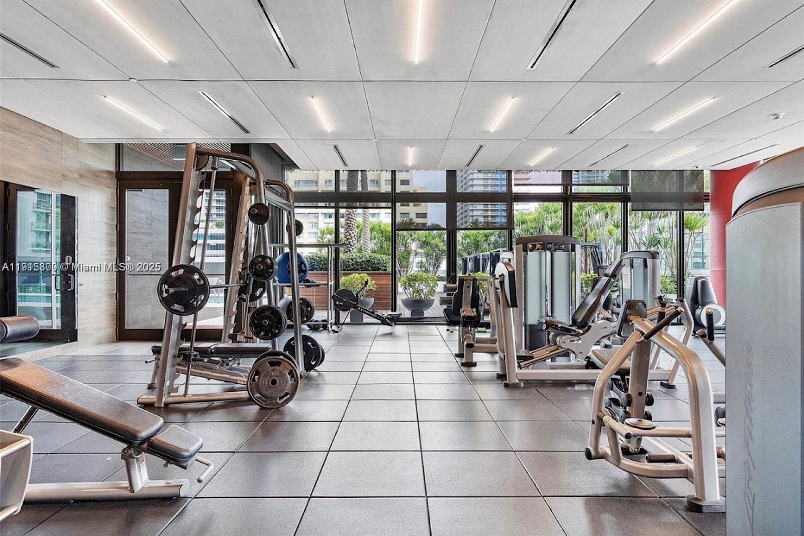 1080 Brickell Avenue, Unit 3705 Miami, FL 33131 - Photo 27 of 32 a view of a room with gym equipment